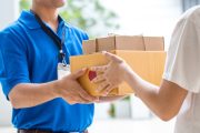 woman-hand-accepting-delivery-boxes-from-deliveryman-1-1024x683